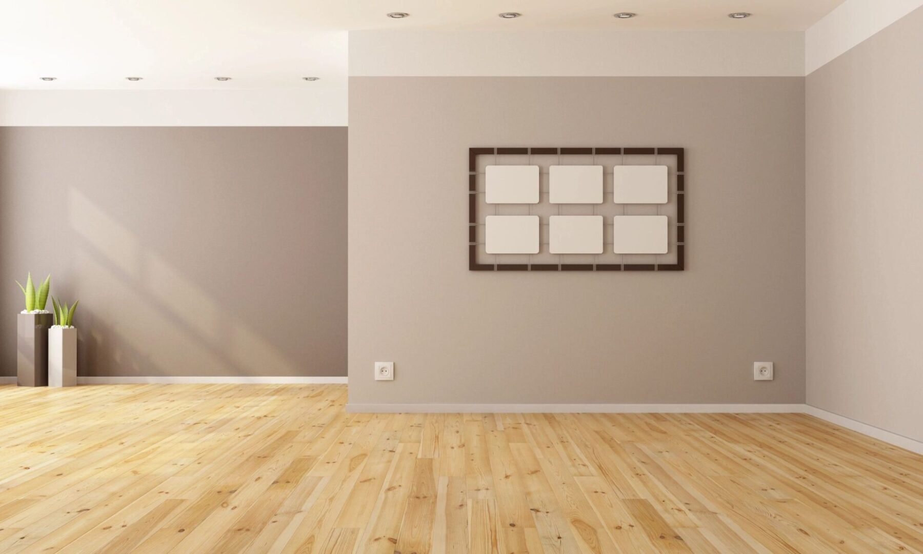 A room with wood floors and a picture frame on the wall.