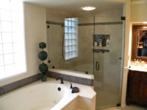 A bathroom with a tub, shower and sink.